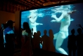 viewers-on-mimetic-stage-interacting-with-silouettes-and-video