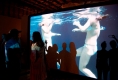 viewers-on-mimetic-stage-interacting-with-silouettes-and-video